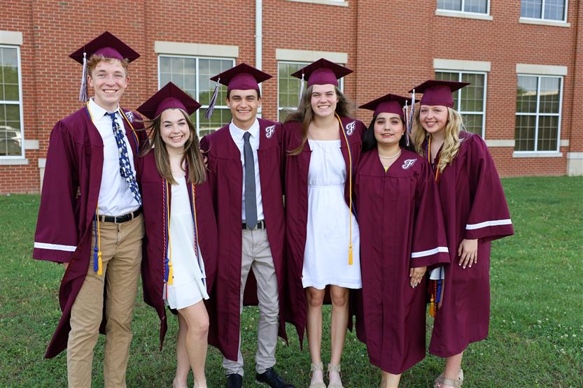 Graduates wearing maroon robes